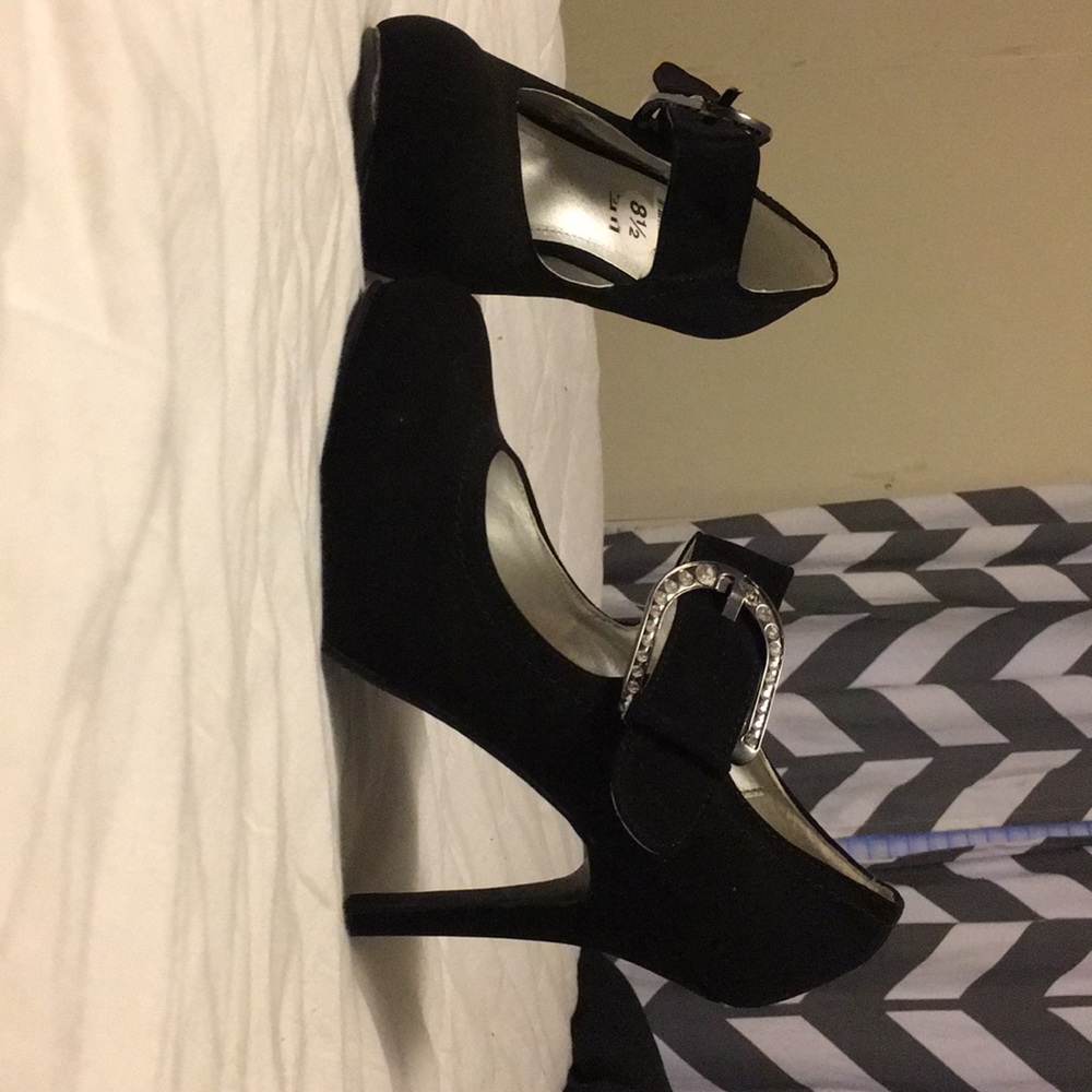 Black buckled high heel shoes